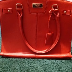 New in plastic BCBG red purse